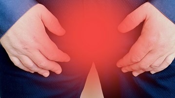 En mans skrev med röd markering. För att illustrera prostatacancer.